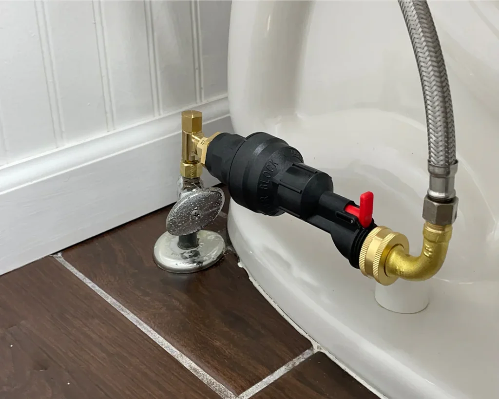 How to Fix a Rattling Toilet Pipe When Flushing: 5 Easy Steps 2 The Water Block Running Toilet Shutoff Device Installed On A Toilet In The Horizontal Orientation 60a48e48 074e 420f af80 545b3f318428