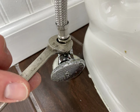 How to Fix a Rattling Toilet Pipe When Flushing: 5 Easy Steps 3 Water Supply Hose Connected To A Water Supply Valve With .625 Wrench 8ddd5986 716e 4987 b4d1